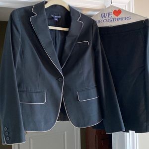 Two piece suit by Gap with white piping on jacket.